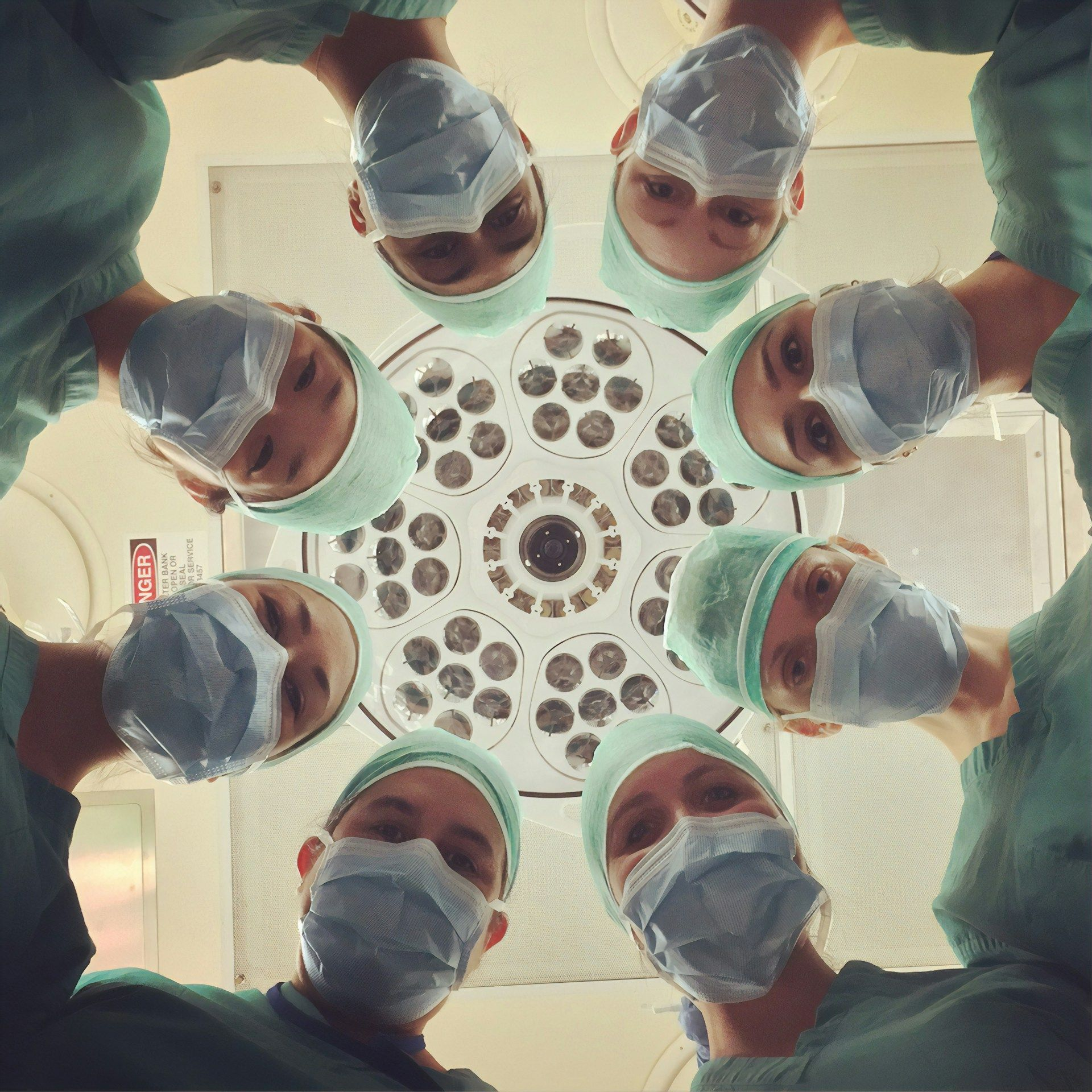 Medical doctors performing a procedure inside an operating room