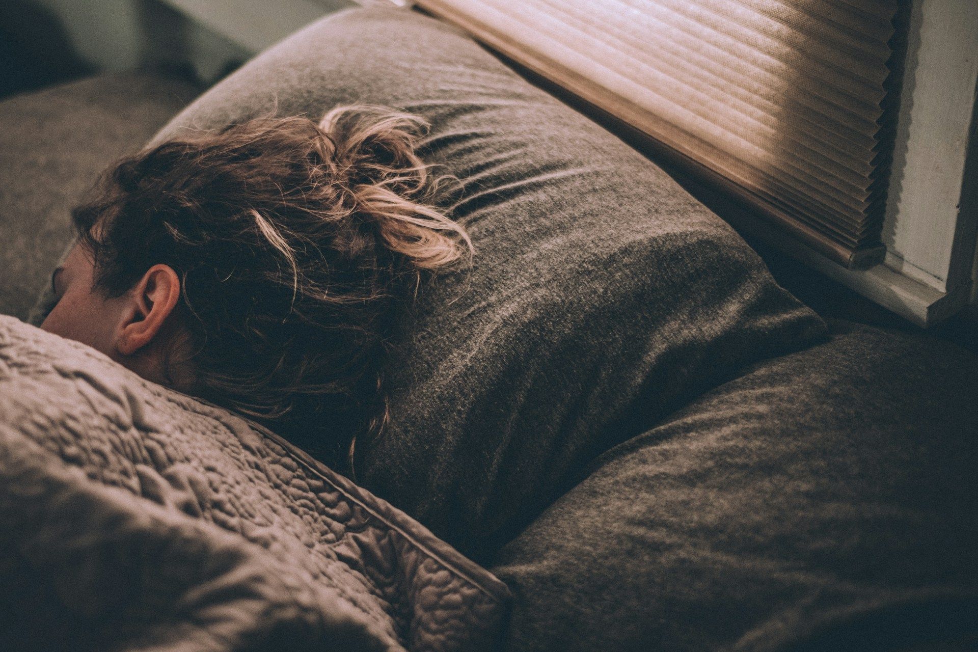 Woman sleeping on a bed