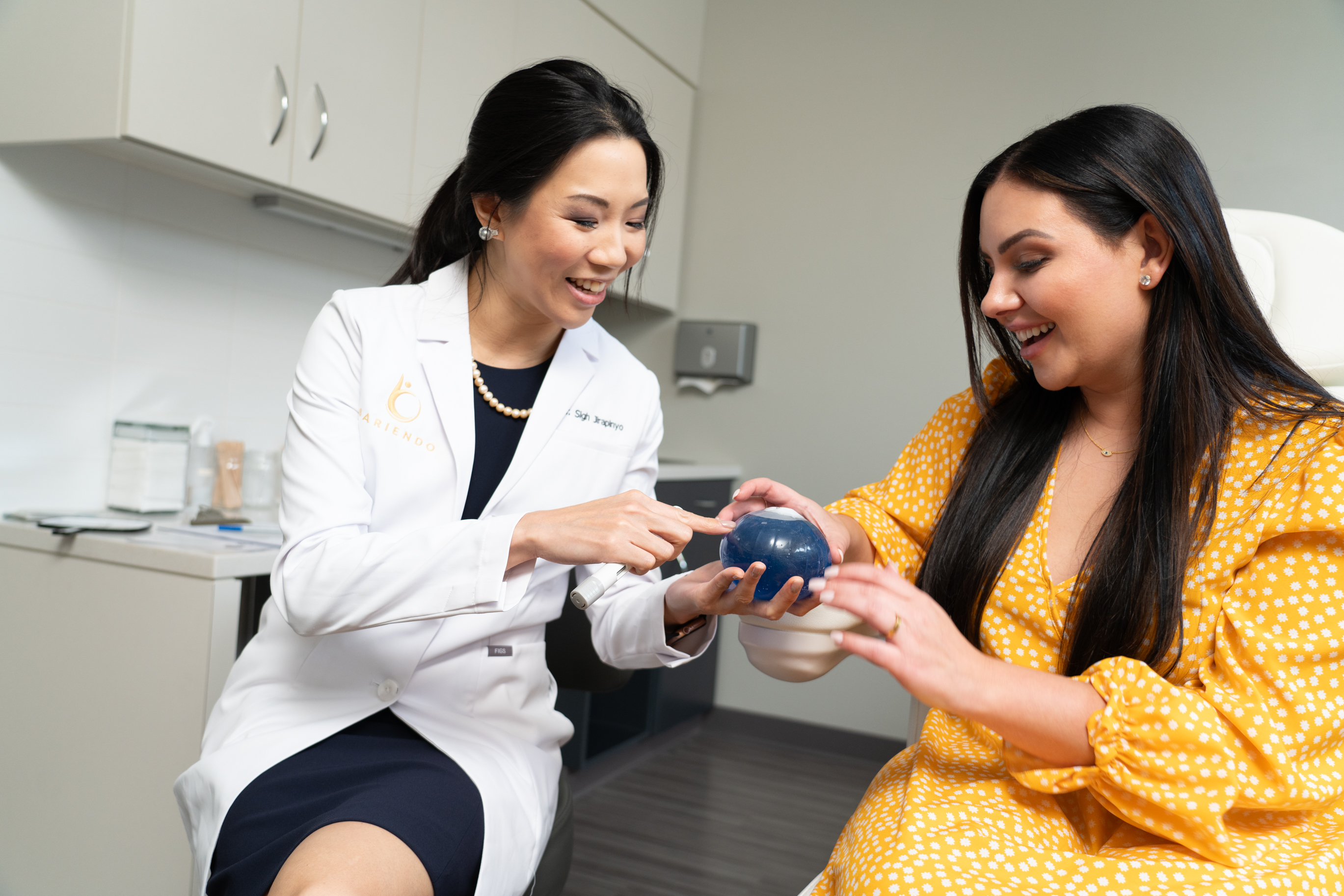 Doctor showing gastric balloon to patient