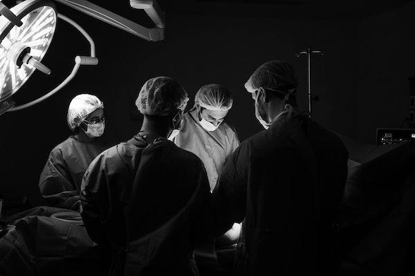 a group of doctors in an operating room