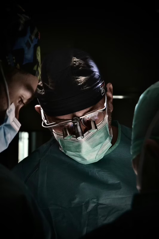 Surgeons focused during a medical procedure.