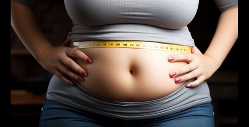 A woman measuring her waist with a tape measure, highlighting their midsection and hands on their hips, symbolizing weight loss or fitness efforts.