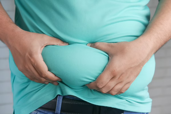 a person holding his stomach with his hands